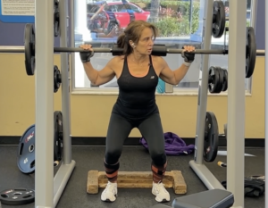 Woman over 50 doing resistance training alongside creatine supplementation