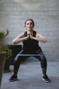 Woman over 50 doing resistance training to close the healthspan gap